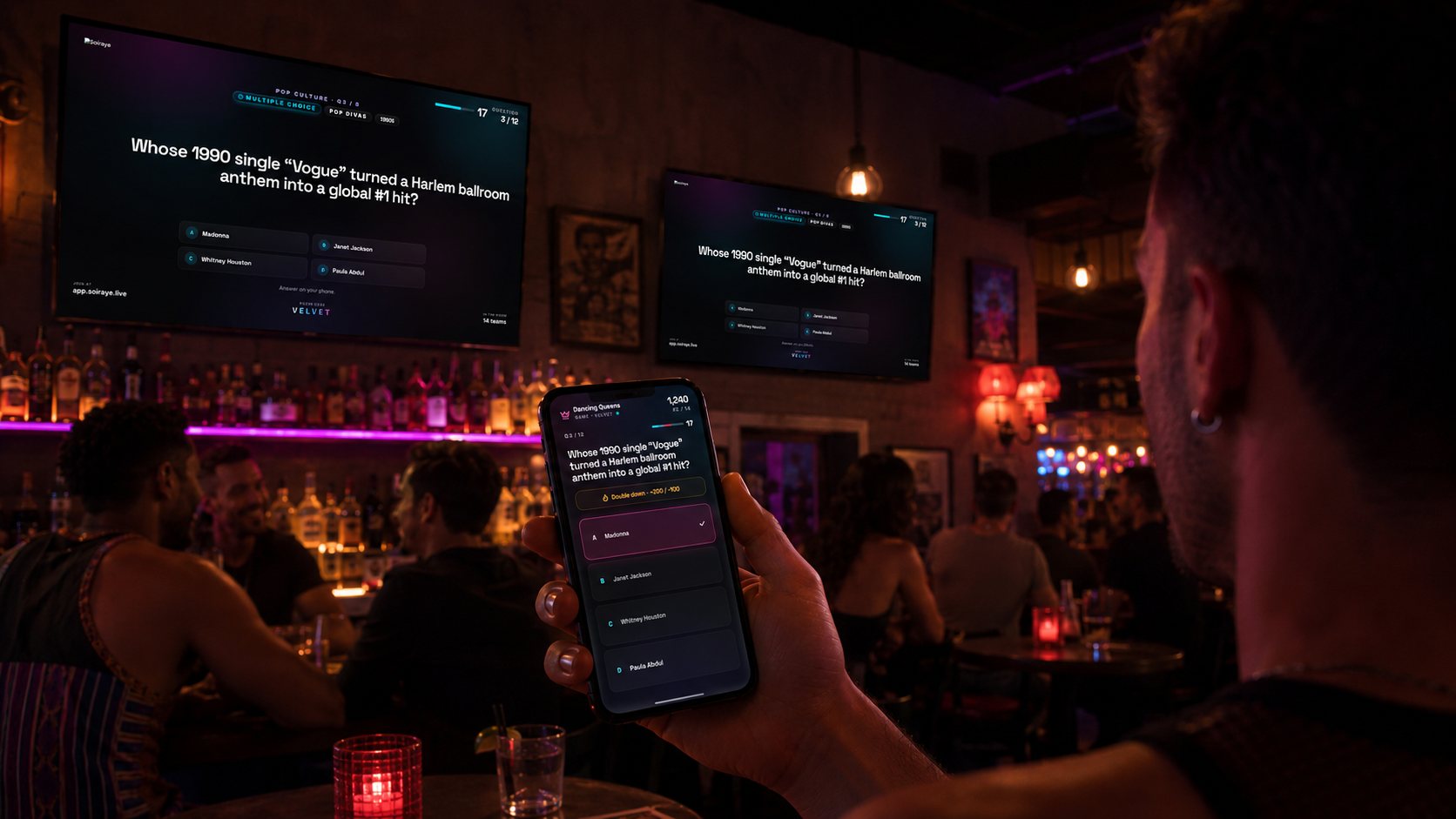 A relaxed gay bar on a quieter night — the Channel running on its own across the bar TVs with a question and a join QR, a regular at the bar tapping in an answer on his phone, no host needed.